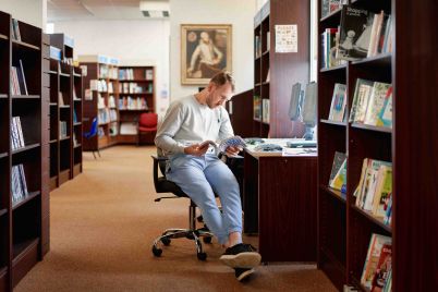 Adult-reading-Nat-Year-Reading-scaled.jpg